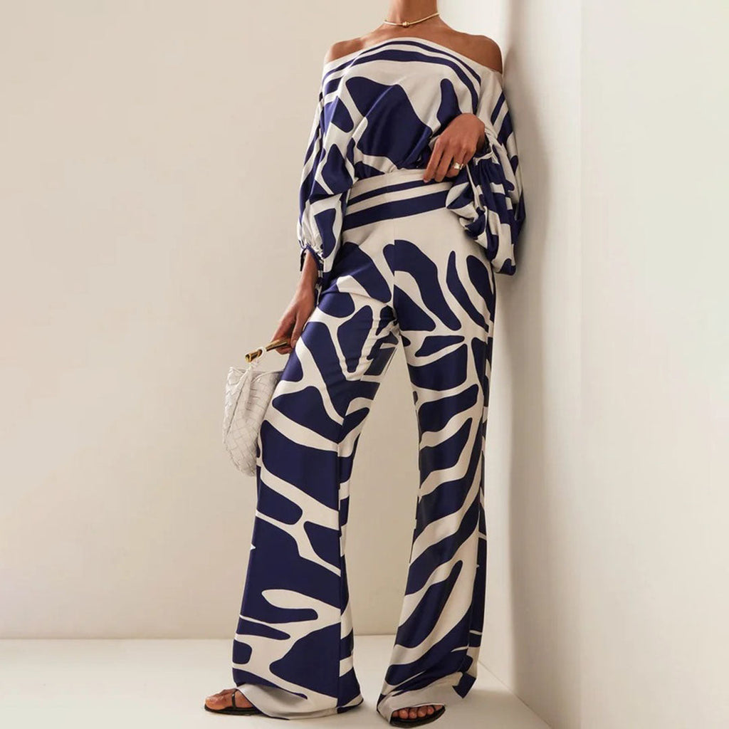 Completo estivo chic da donna in due pezzi, top fluido stampato e pantaloni larghi, outfit elegante casual per le vacanze